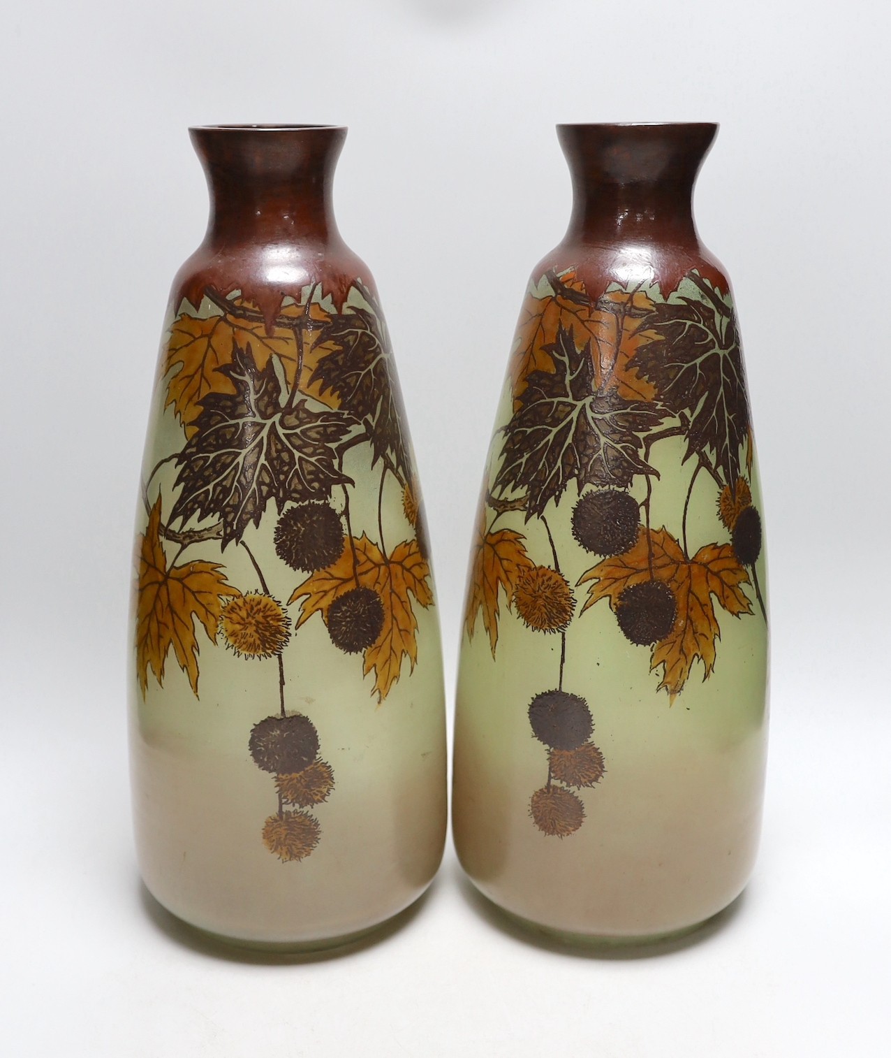 A large pair of French glass enamelled vases with autumnal design. 42cm tall